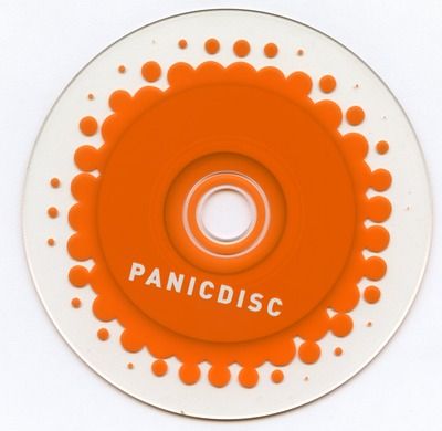 A CD-ROM with transparent edges and orange Panic logo shape that reads Panic Disc in all-caps white text